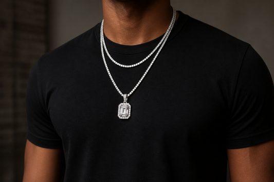 Man in a black shirt wearing layered silver moissanite chains and pendant