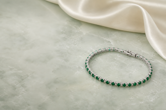 925 sterling silver emerald lab gemstone tennis bracelet on pale green marble