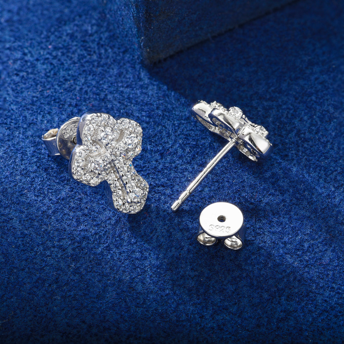 Layered cross moissanite stud earrings in silver tone