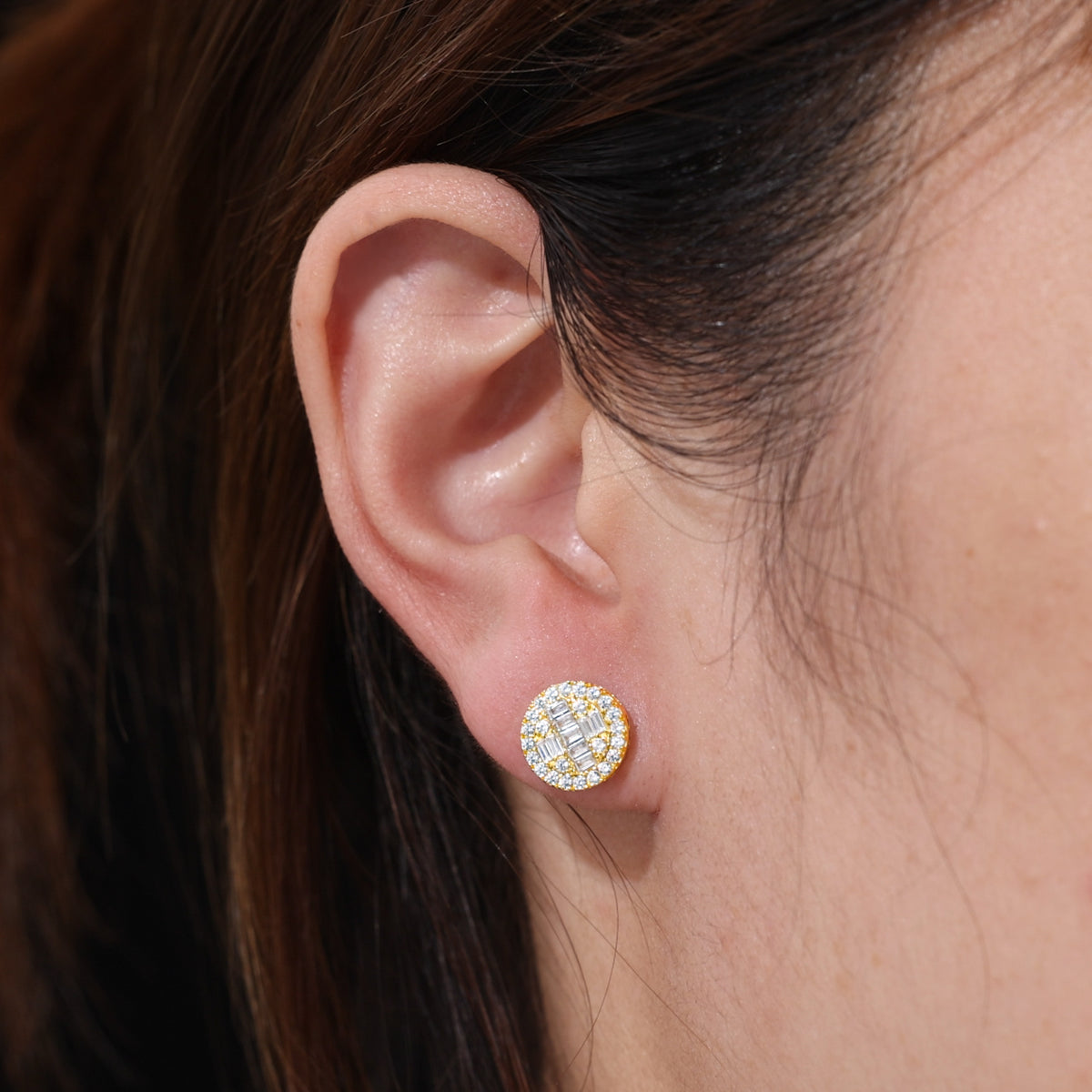Gold-tone round baguette cluster stud earrings worn