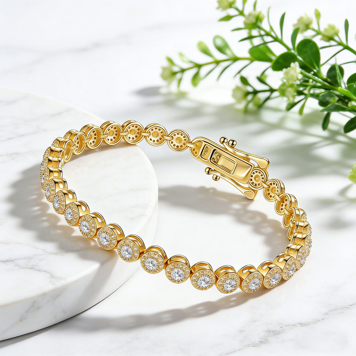 Gold-tone bezel-set moissanite tennis bracelet on a marble display