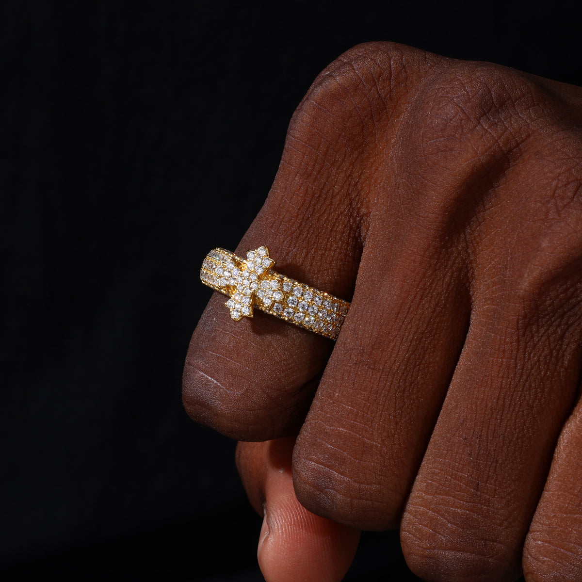 Gold tone triple-row cross band moissanite ring worn