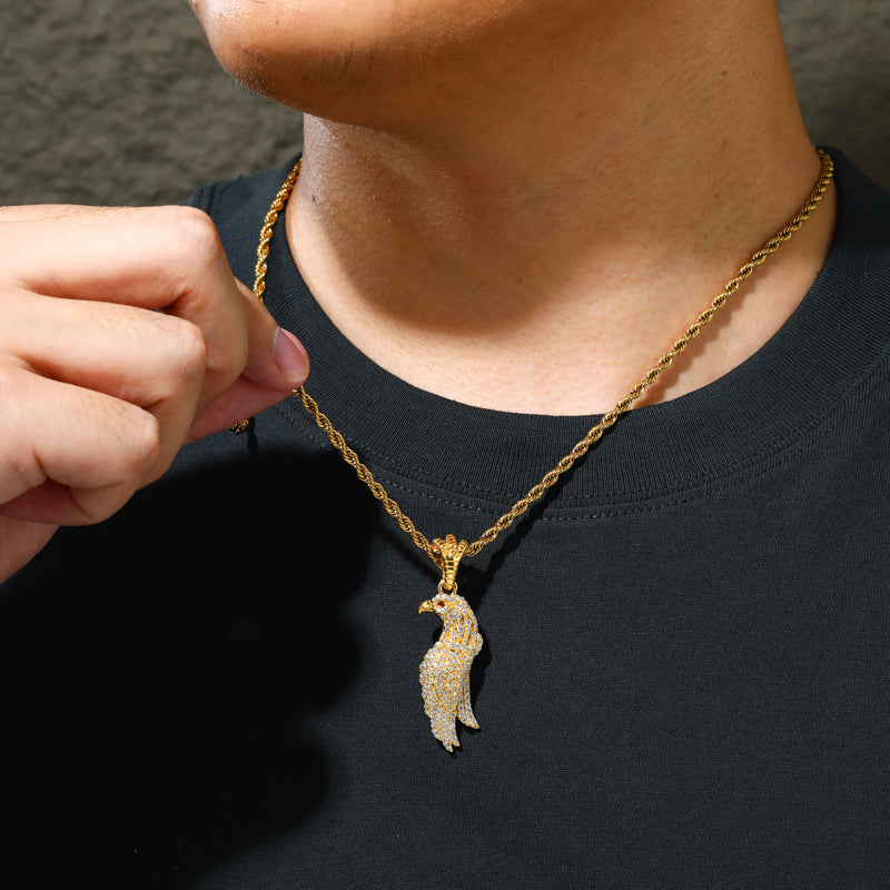 Gold-tone eagle moissanite pendant worn