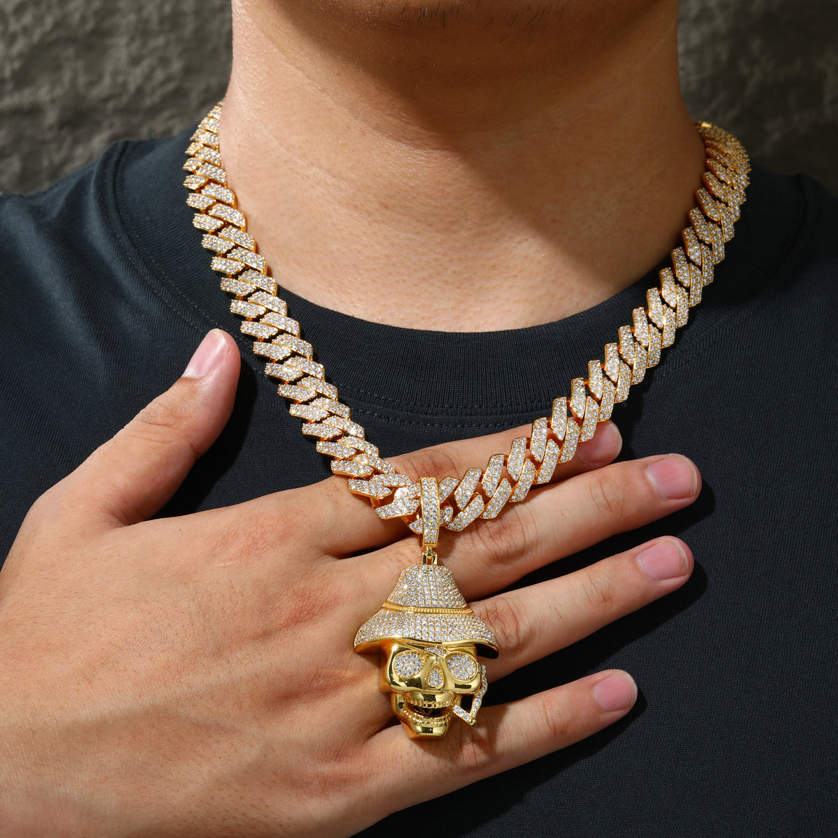 Gold-tone iced-out skull hat moissanite pendant worn