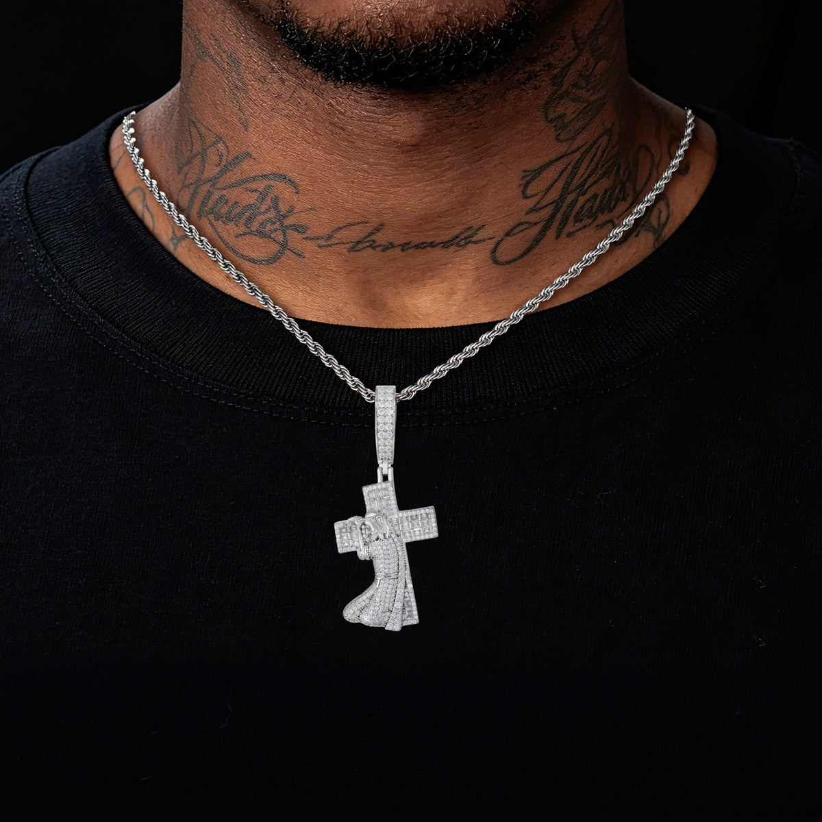 Silver tone Jesus carrying cross moissanite pendant worn
