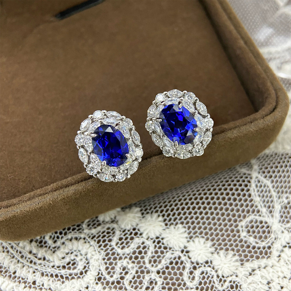 Blue sapphire oval halo stud earrings