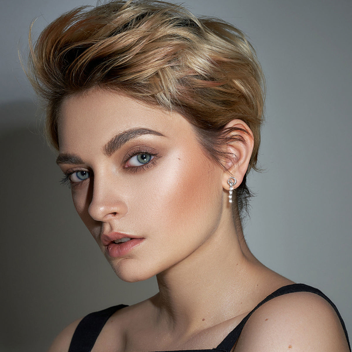Tennis drop earrings worn