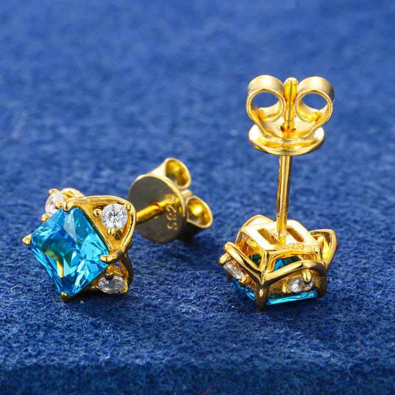 Gold-tone blue CZ and moissanite stud earrings