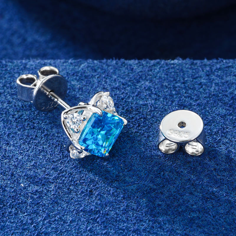 Gold-tone blue CZ stud earring side view