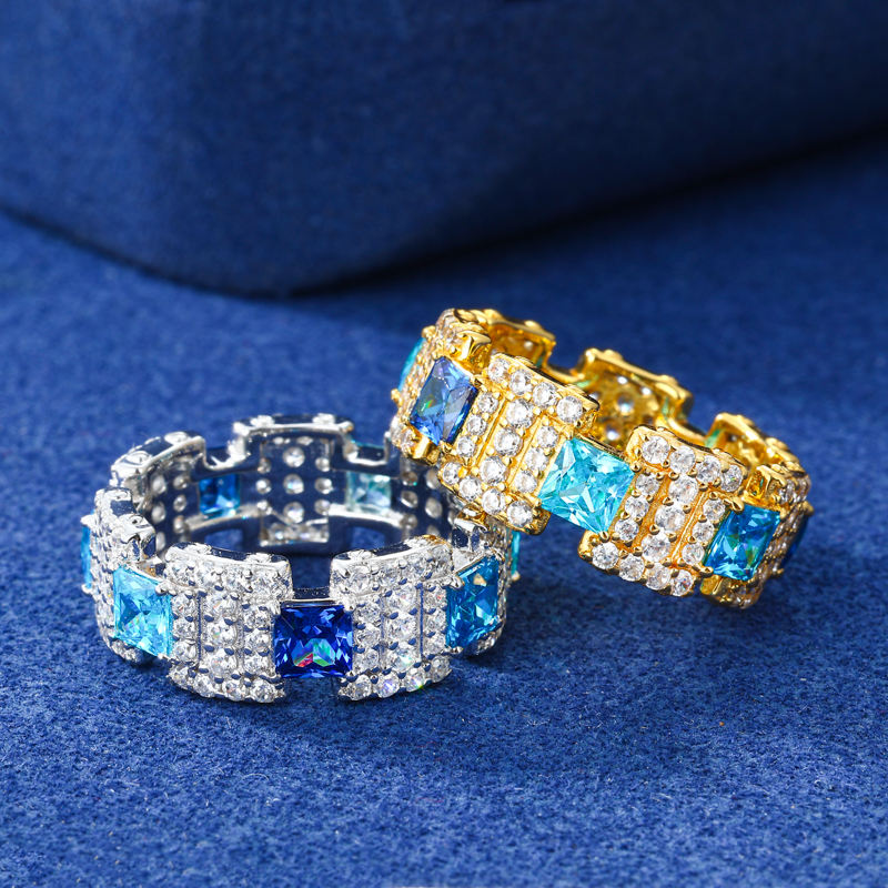 Gold-tone blue CZ geometric band ring