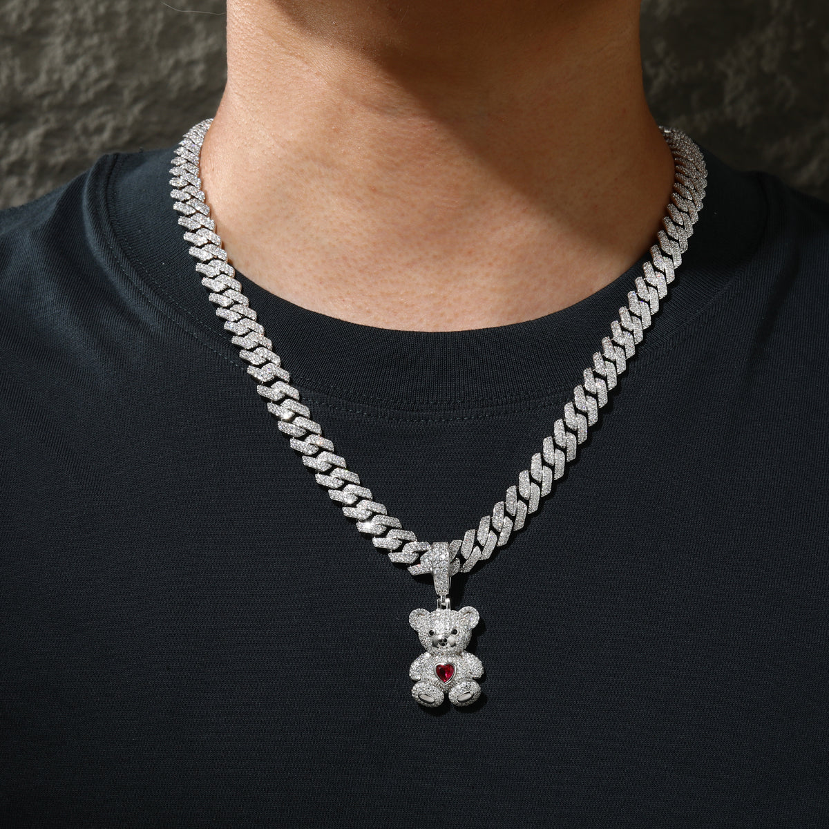 Silver-tone teddy bear moissanite pendant styled with Cuban chain
