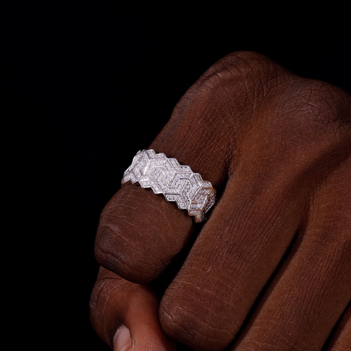 Silver-tone geometric moissanite ring on hand