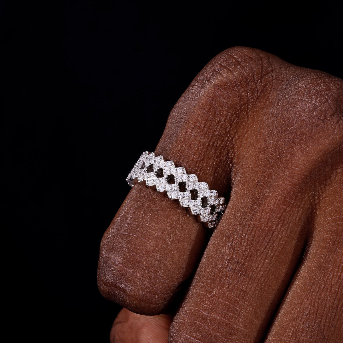 Silver-tone triple-row moissanite band on hand