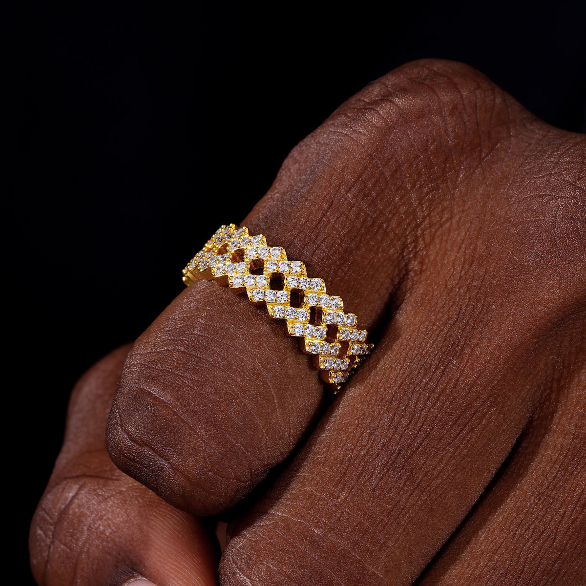 Gold-tone triple-row moissanite band on hand