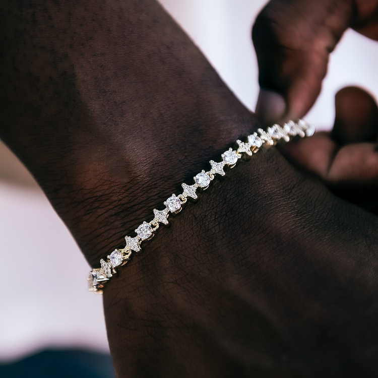 Star moissanite tennis bracelet worn on the wrist