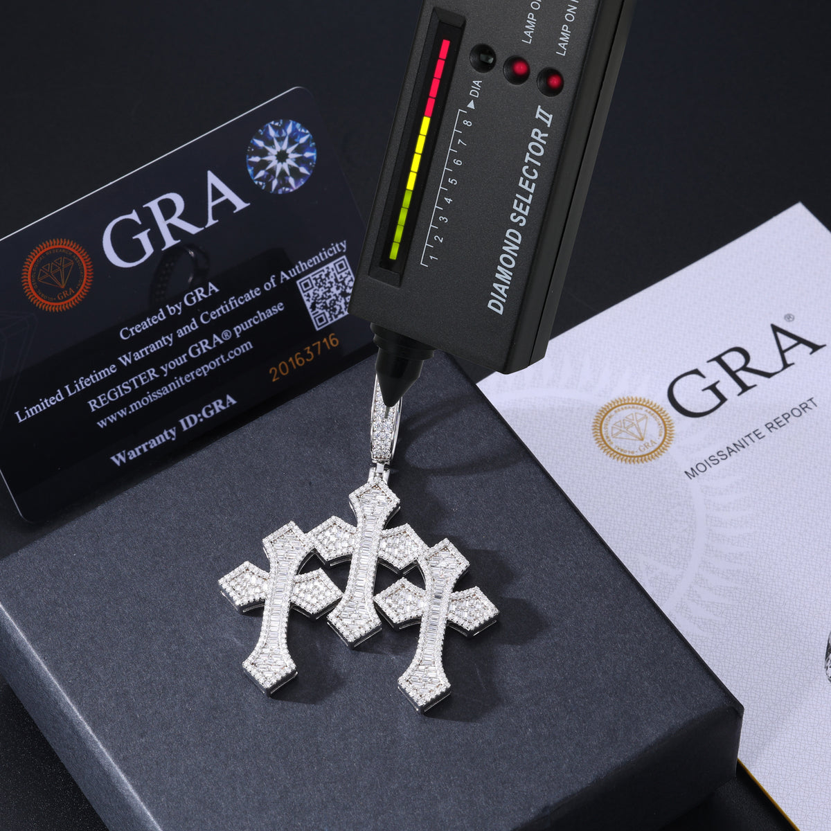 Close-up of baguette and round moissanite on a triple cross pendant