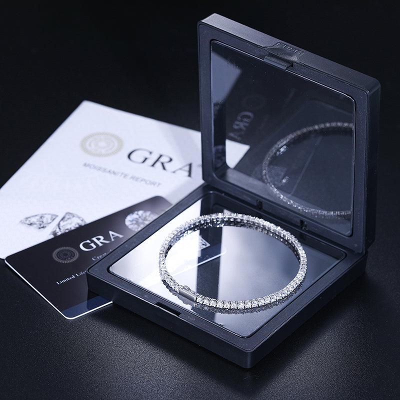 Moissanite tennis bracelet displayed with GRA materials