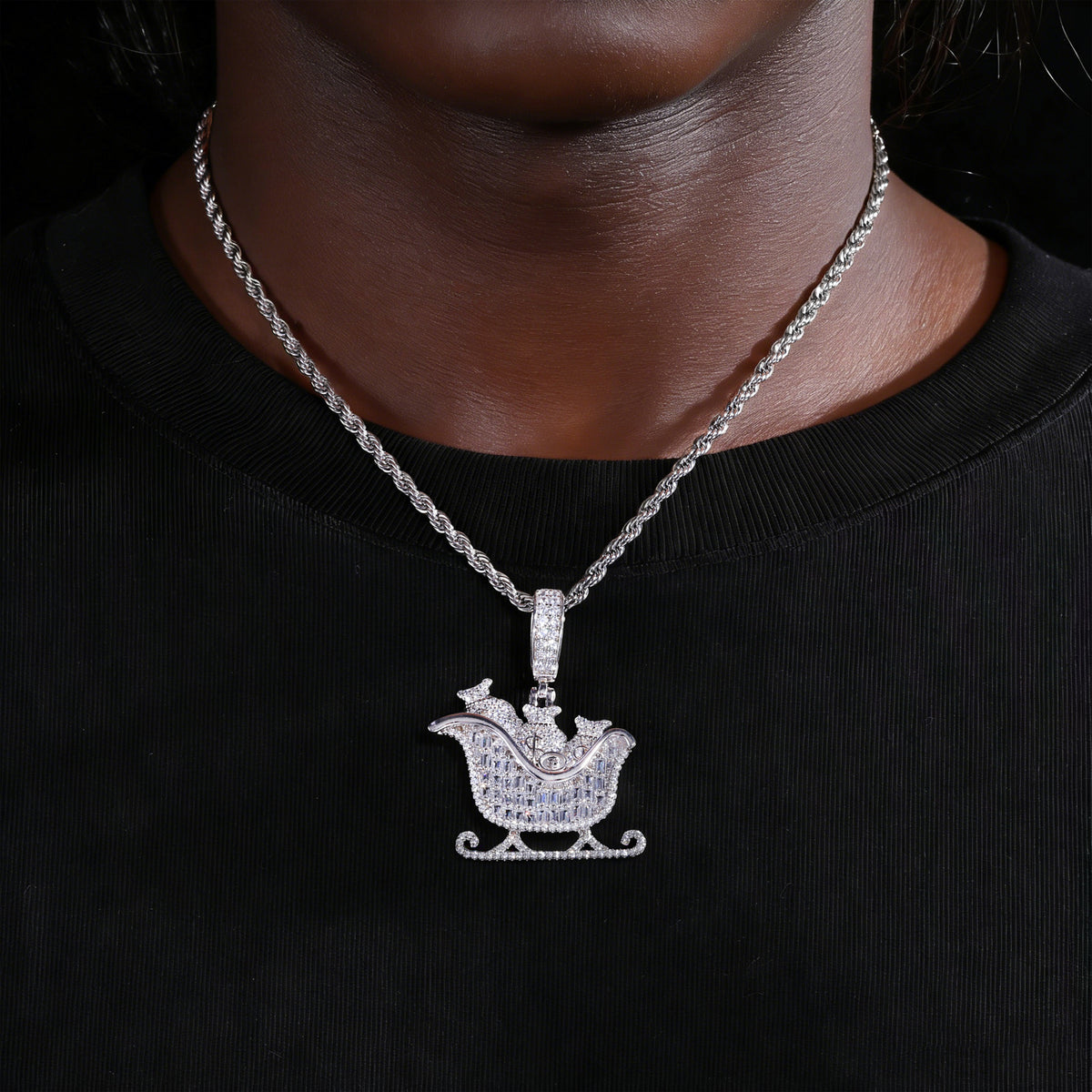 Silver-tone money bag sleigh moissanite pendant worn