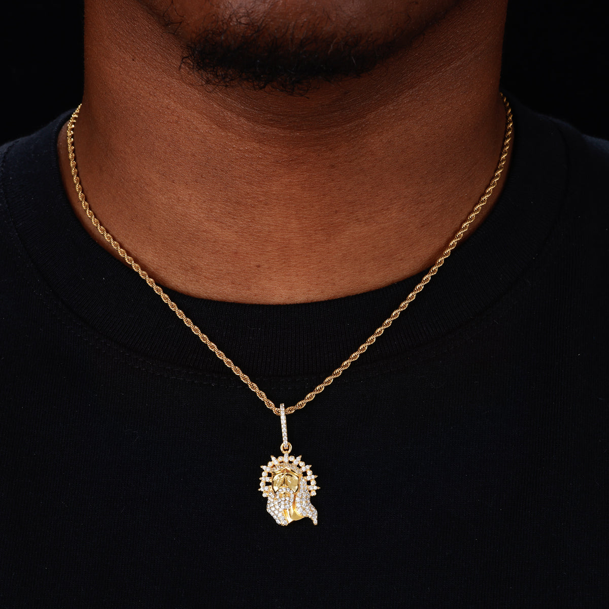 Gold-tone radiant Jesus moissanite pendant worn