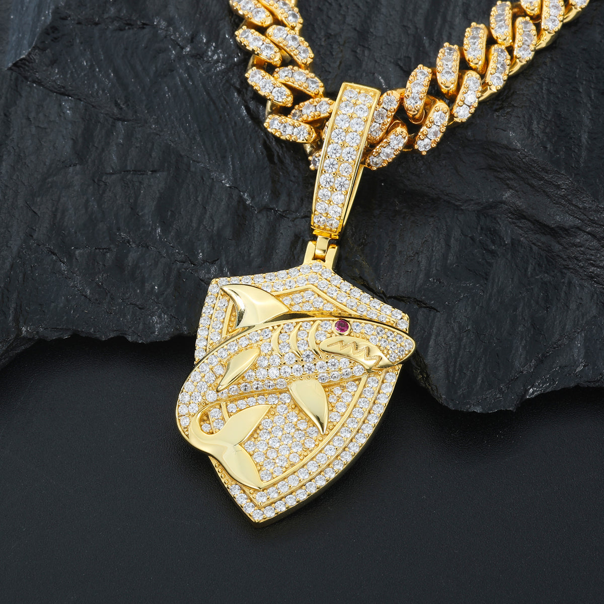 Gold tone shark shield moissanite pendant