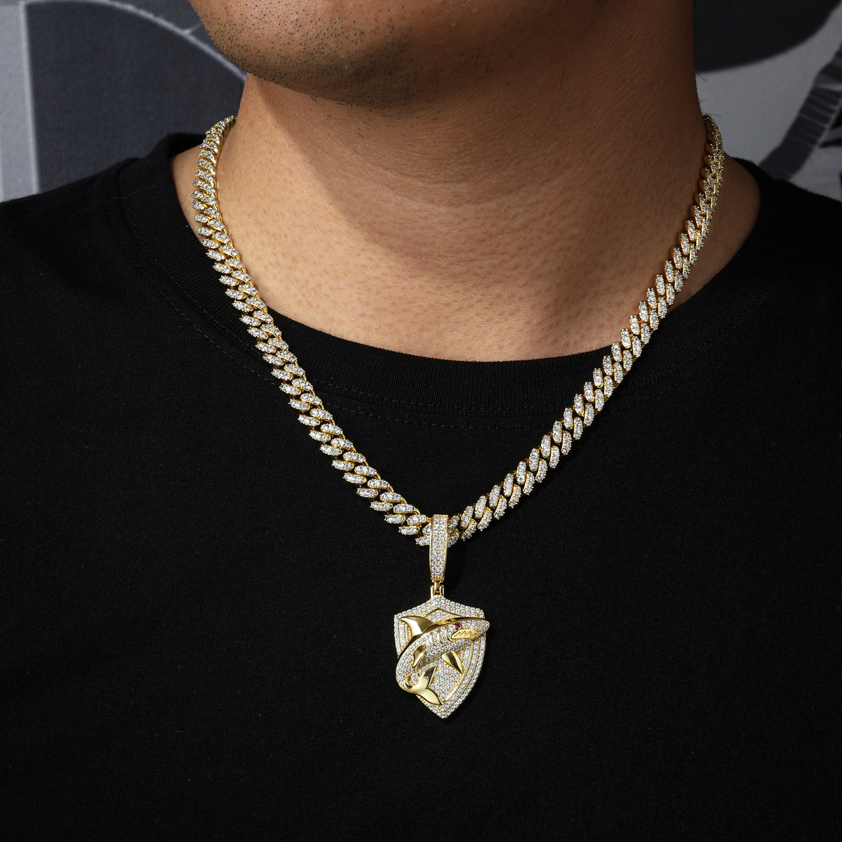 Gold tone shark shield moissanite pendant worn