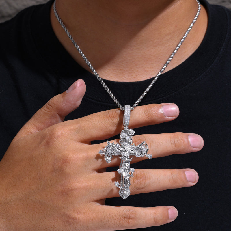 Thorned crucifix moissanite pendant shown for scale