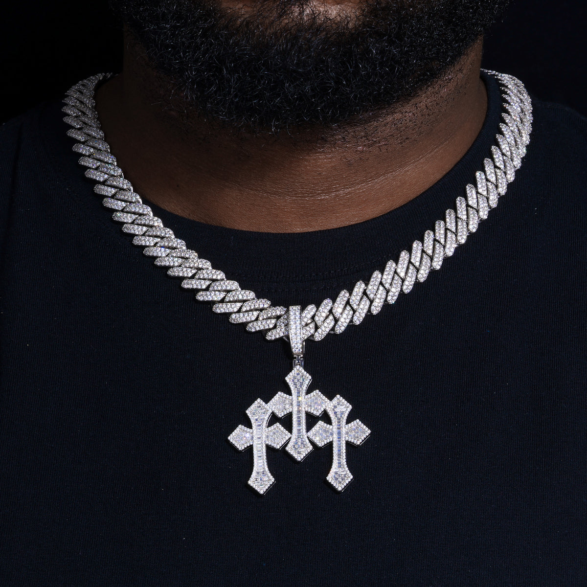 Triple cross moissanite pendant on a Cuban link necklace