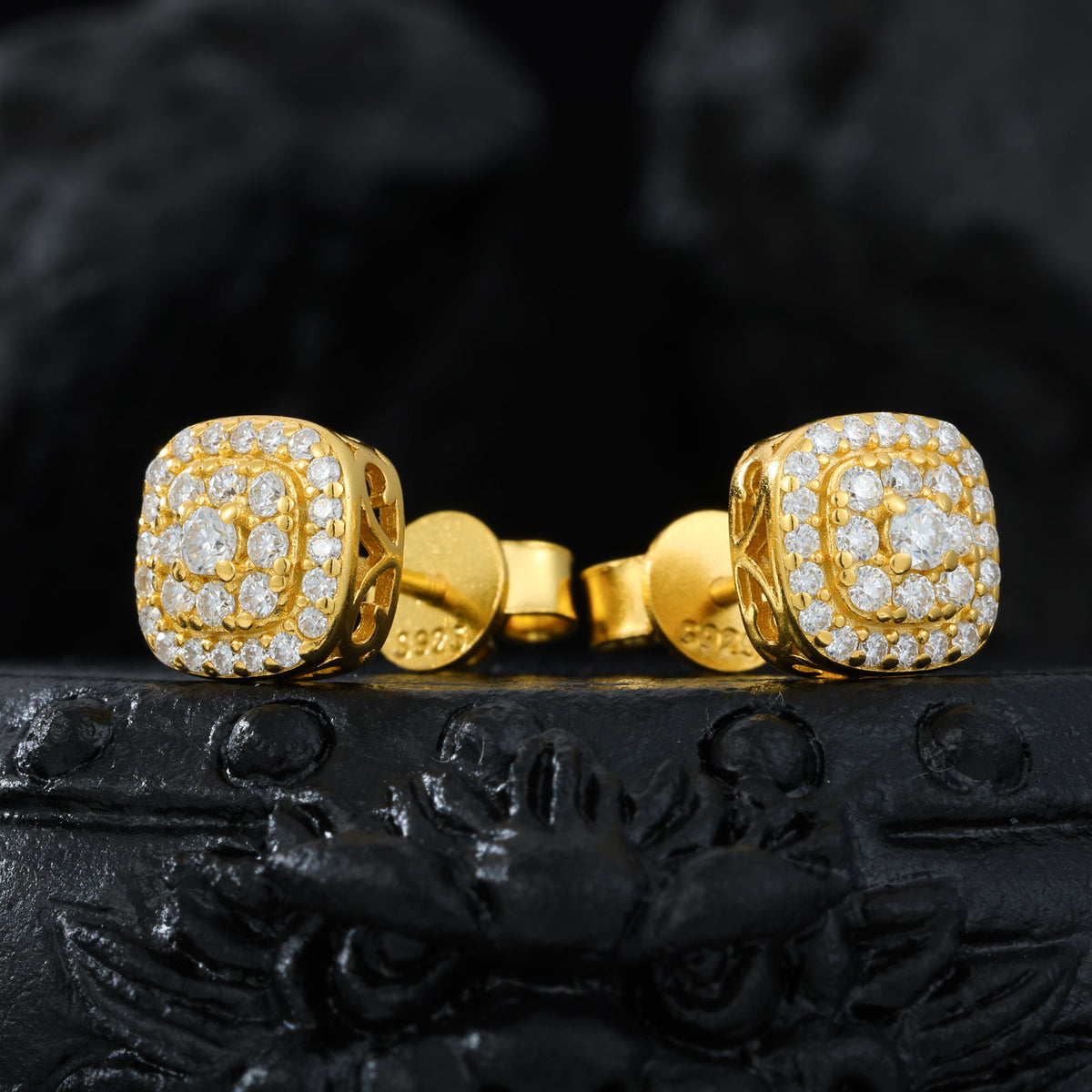 Gold-tone triple-row moissanite stud earrings, side view